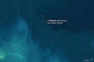 A close-up of the satellite image shows the foam separating two masses of water in the Garabogazköl lagoon.