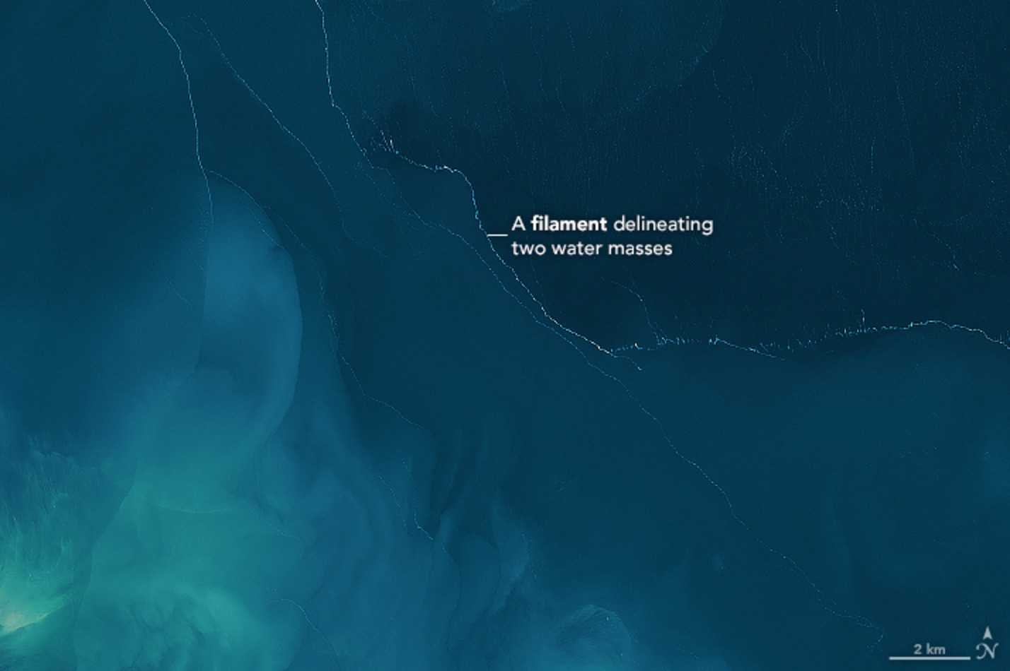 A close-up of the satellite image shows the foam separating two masses of water in the Garabogazköl lagoon.