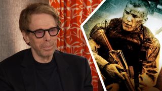 Jerry Bruckheimer alongside the poster for Black Hawk Down