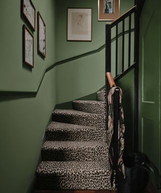 Jadeite-807 painted entryway and stairwell with gallery wall, chair rail molding and leopard print accent stairs