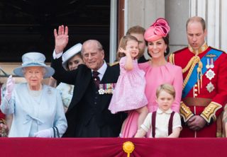 Queen Elizabeth II, Prince Philip, Duke of Cambridge, Catherine, Duchess of Cambridge, Princess Charlotte of Cambridge, Prince George of Cambridge and Prince William, Duke of Cambridge look on from the balcony during the annual Trooping The Colour parade on June 17, 2017 in London, England