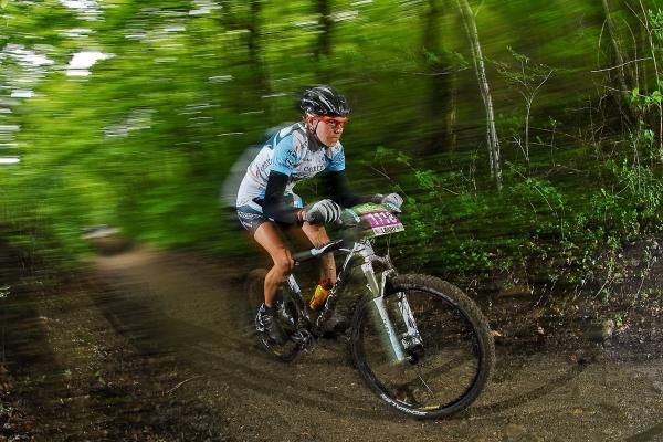 Anja Gradl (Central Pro) races through the trees.