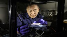 Rochester researcher Chunlei Guo tests a solar thermoelectric generator (STEG) etched with femtosecond laser pulses to boost solar energy absorption and efficiency in a lab.