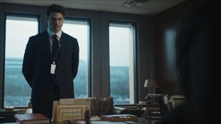 Owen stands in an office talking to his boss in The Recruit season 2