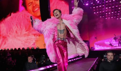 Harry Styles iconic outfits. Harry Styles performs on the Coachella stage during the 2022 Coachella Valley Music And Arts Festival on April 22, 2022 in Indio, California
