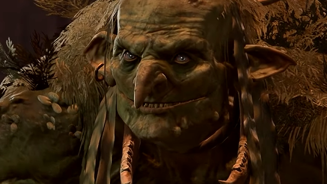 Auntie Ethel, a hag from Baldur&#039;s Gate 3 with a twisted mien and a cruel smile, grins at the viewer.