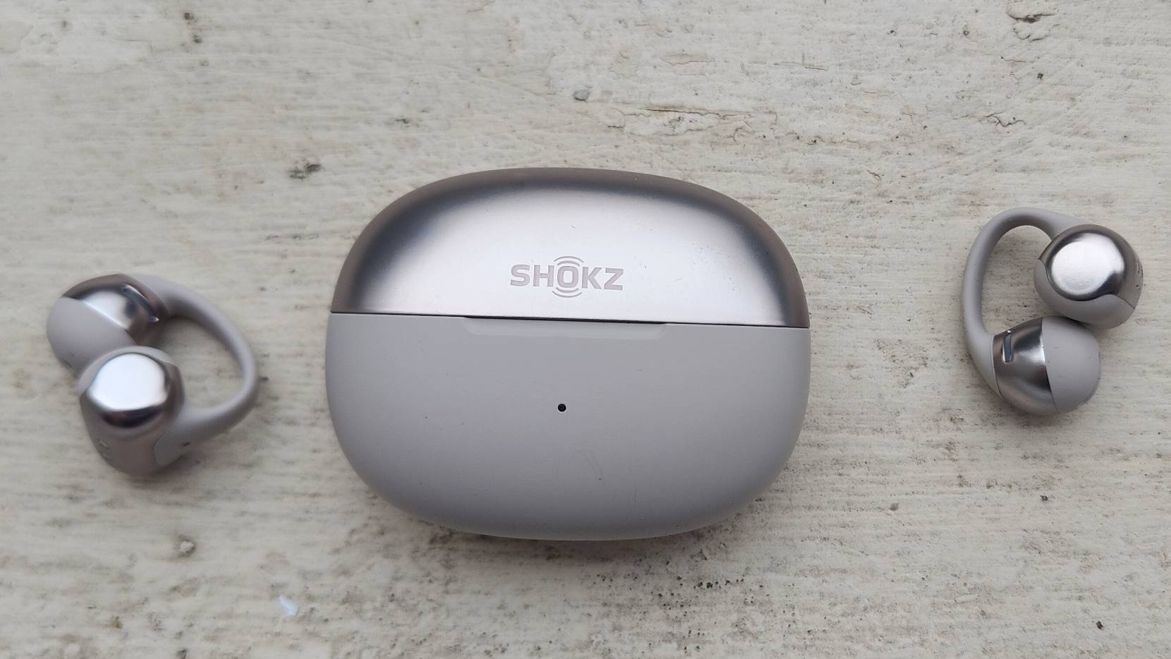 The Shokz OpenDots One on a white windowsill