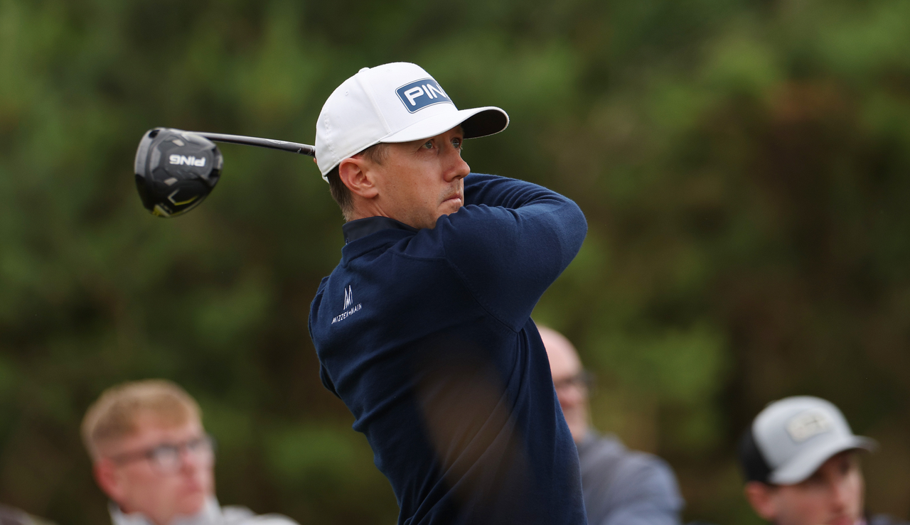 Mackenzie Hughes strikes a tee shot with a driver