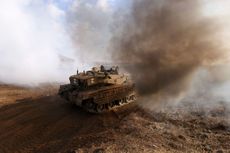 An Israeli tank takes part in an military exercise near Kibbutz Ortal in the Israel-annexed Golan Heights near the Lebanon border on November 15, 2023