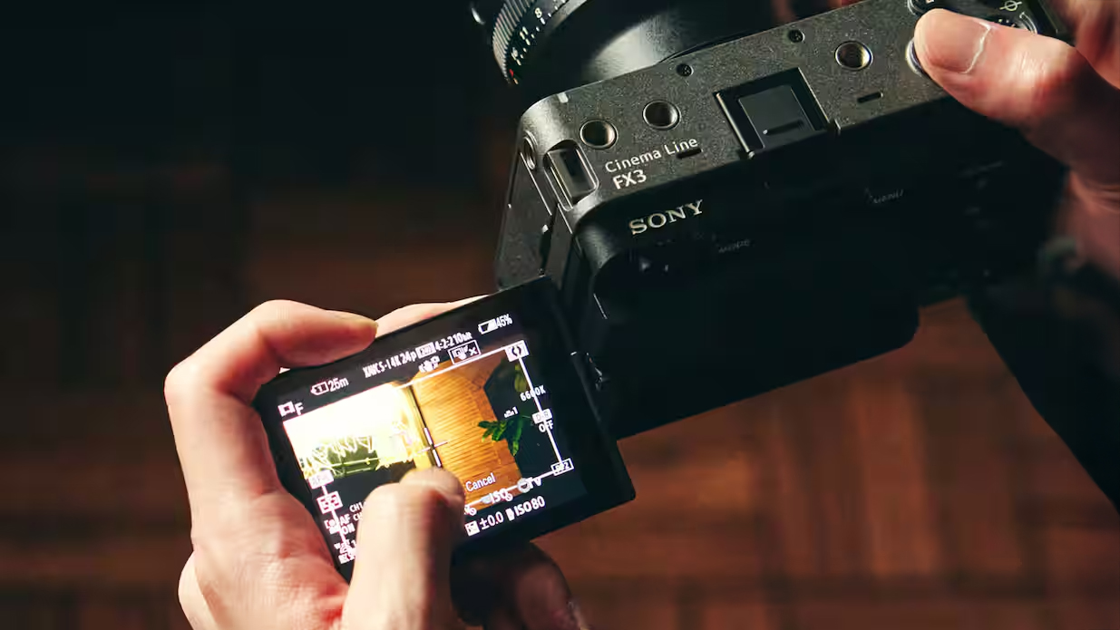 Videographer holding a Sony FX3