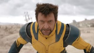 Wolverine in yellow costume bending over and preparing to charge in Deadpool & Wolverine