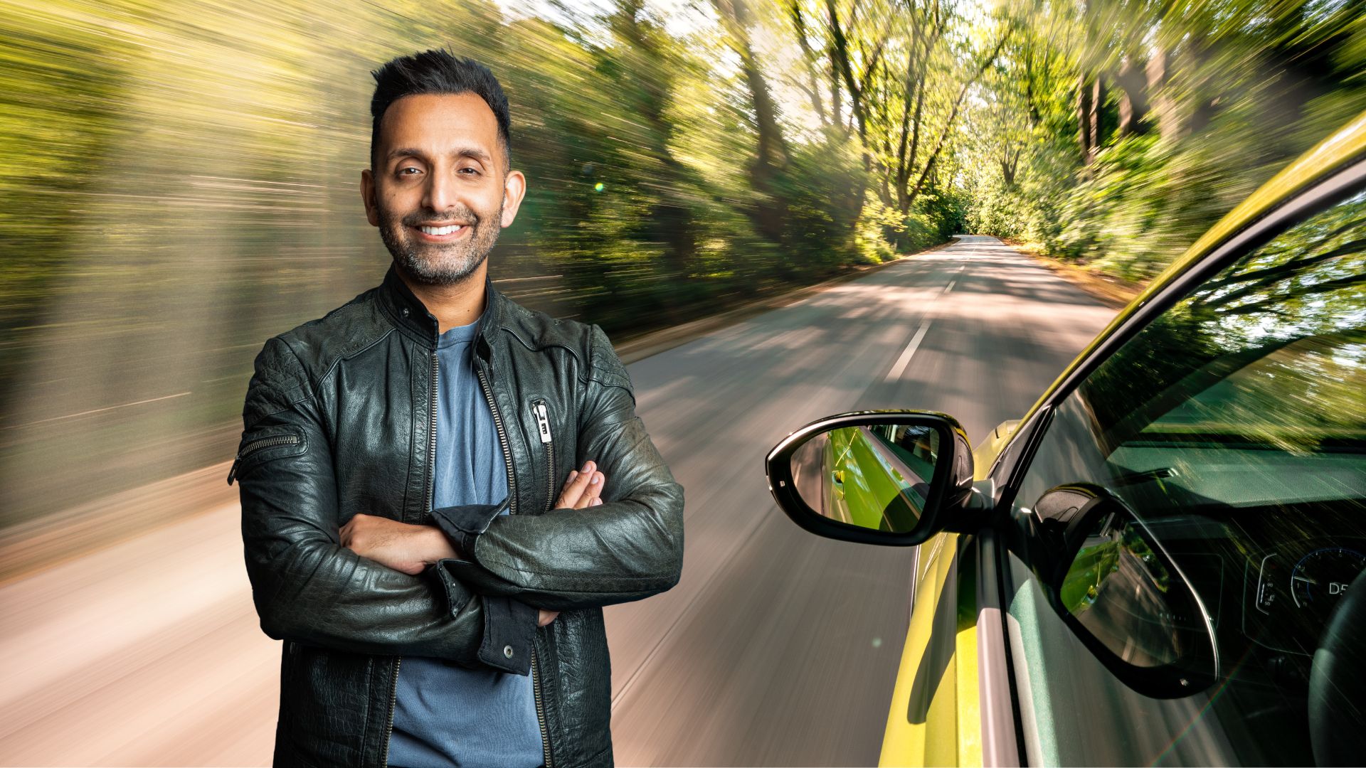 Dr Amir Khan standing against a backdrop of moving car, representing how to prevent car sickness