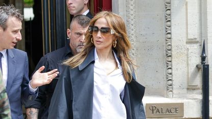 Jennifer Lopez wearing flared denim jeans and a white Hermés Birkin bag in New York City May 2024