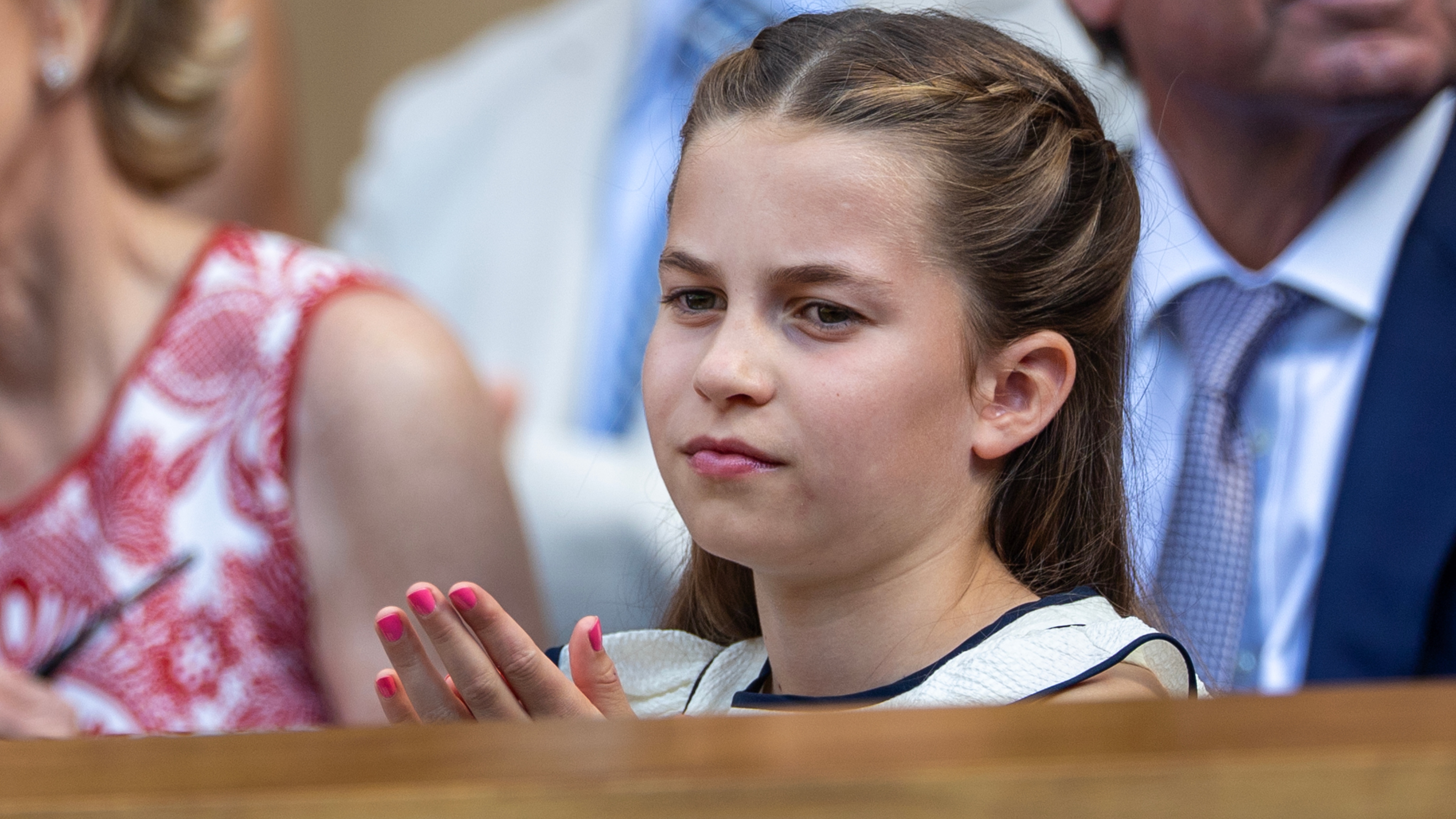 Princess Charlotte of Wales with her finger nails painted pink, in the Royal Box for the Gentlemen's Singles Final on Centre Court at Wimbledon on July 13th, 2025
