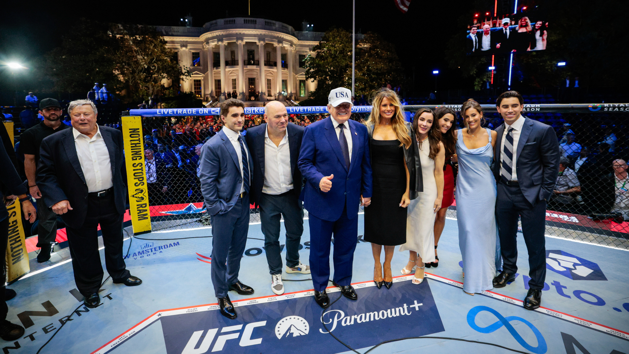 President Donald Trump and his family pose in front of White House in UFC cage