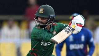 Bangladesh's Mehidy Hasan Miraz plays a shot during a warm-up match ahead of the ICC men's Cricket World Cup 2023.