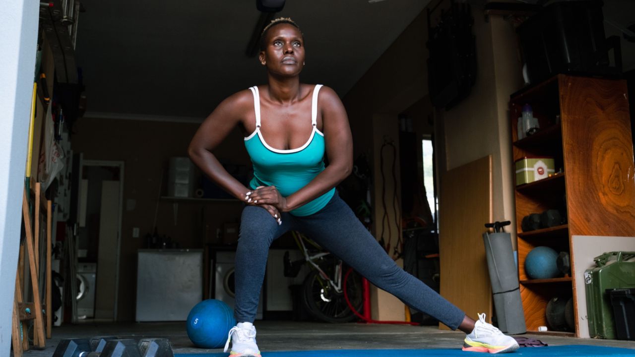 A woman doing lateral lunge