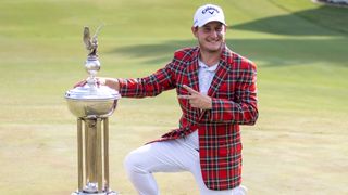 Emiliano Grillo with the trophy after winning the Charles Schwab Challenge