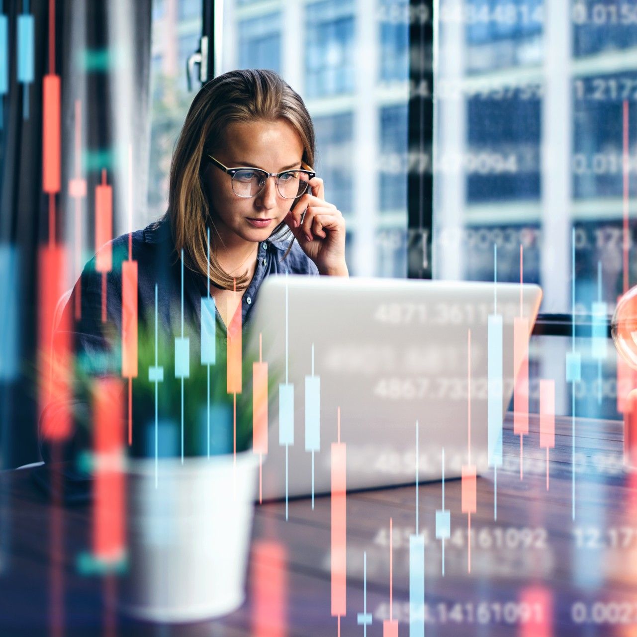 A young woman reviews her investment portfolio.