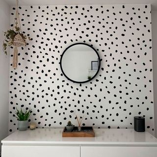 potato print bedroom wall and round mirror