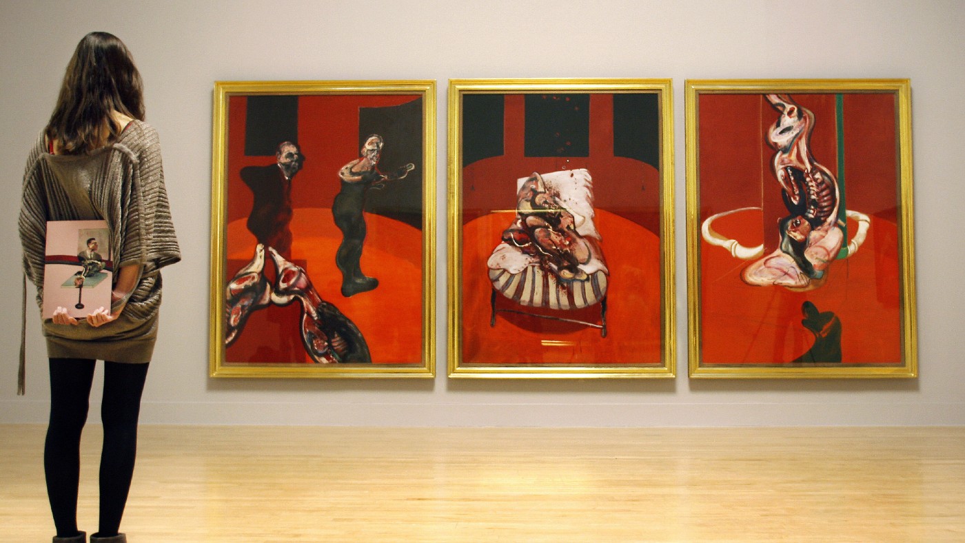 A visitor admires Three Studies for a Crucifixion, 1962