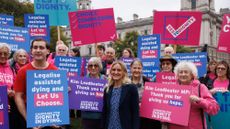 Kim Leadbeater, (C), the Labour MP behind the proposed bill, joins campaigners in Parliament Square on October 16, 2024 in London, England