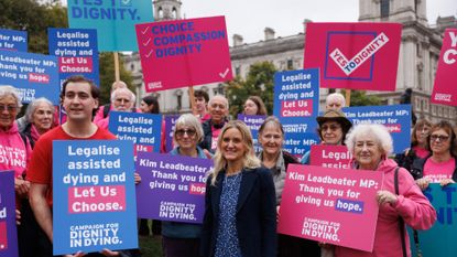 Kim Leadbeater (centre), the Labour MP behind the proposed bill, joins campaigners in Parliament Square on October 16, 2024 in London, England