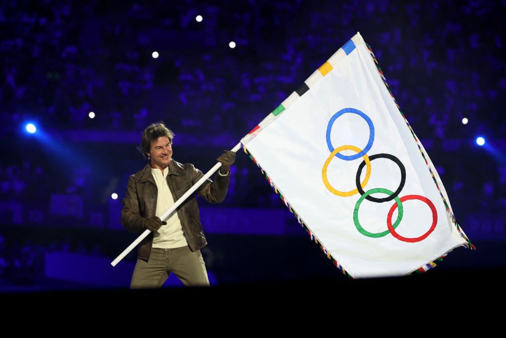 PARIS, FRANCE - AUGUST 11: Actor Tom Cruise holds the Olympic flag during the Closing Ceremony of the Olympic Games Paris 2024 at Stade de France on August 11, 2024 in Paris, France. (Photo by Fabrizio Bensch- Pool/Getty Images) Chelsea