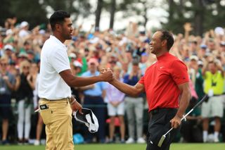Tony Finau and Tiger Woods shake hands after the 2019 Masters
