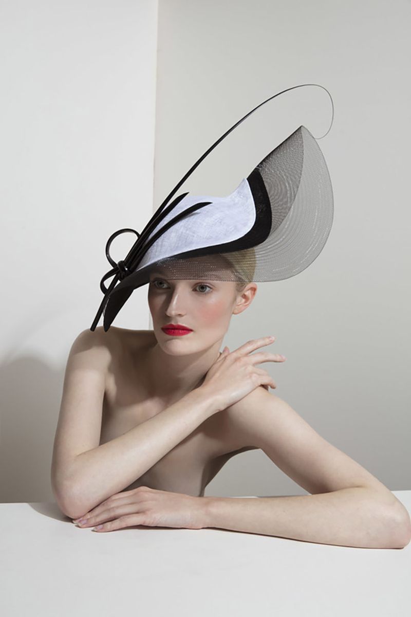 Shoulder, Elbow, Headgear, Costume accessory, Sitting, Eyelash, Model, Photography, Fashion model, Flash photography,
