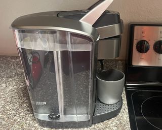 Side view of Keurig K-Elite single-serve coffee maker showing water reservoir