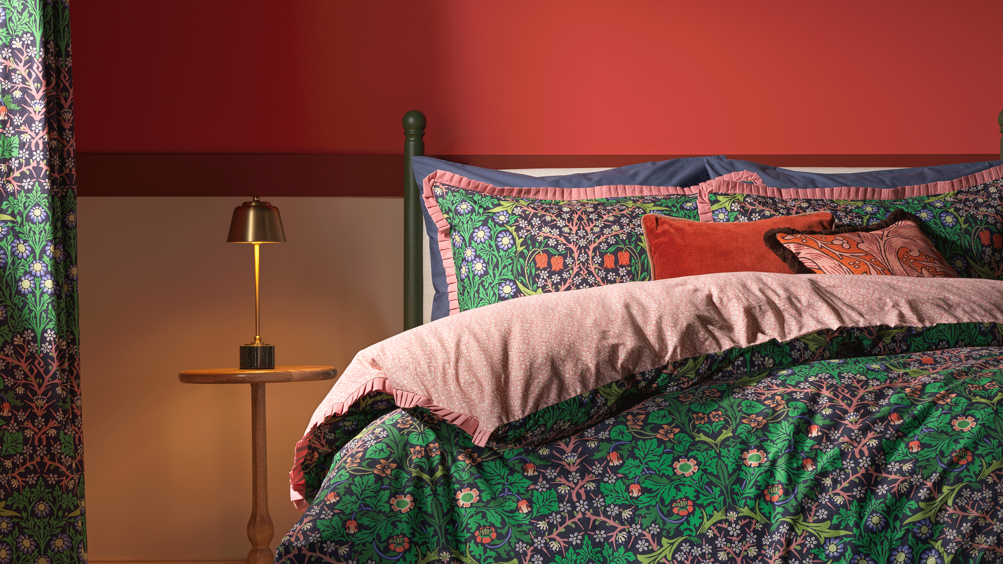 Habitat x Morris &amp; Co green bedding with red wall and wooden side table