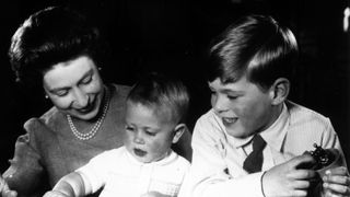 Queen Elizabeth II plays with Princes Edward and Andrew at Windsor Castle