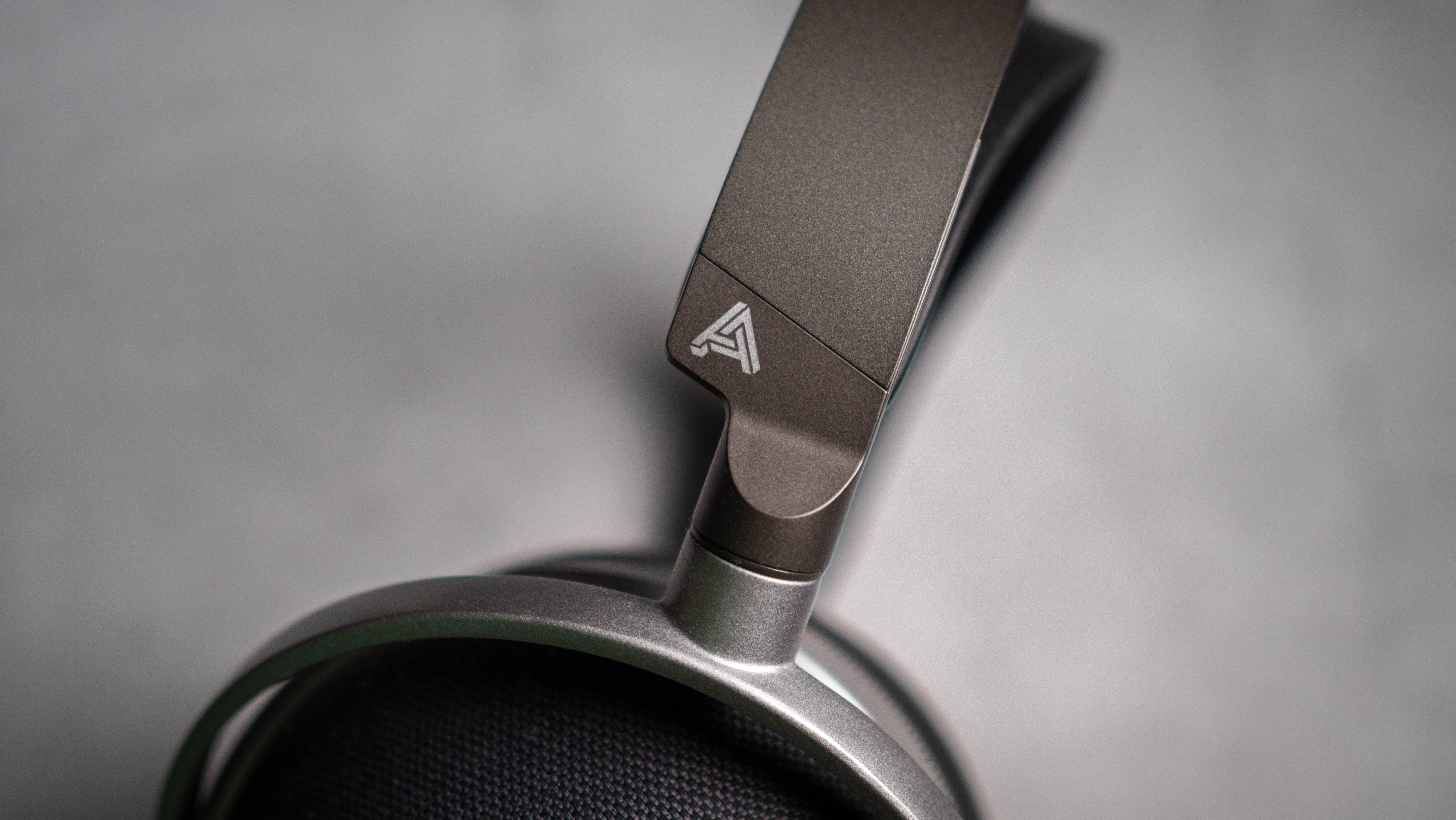 Audeze LCD-S20 planar headset in front of gray kraft sheet highlighting product design