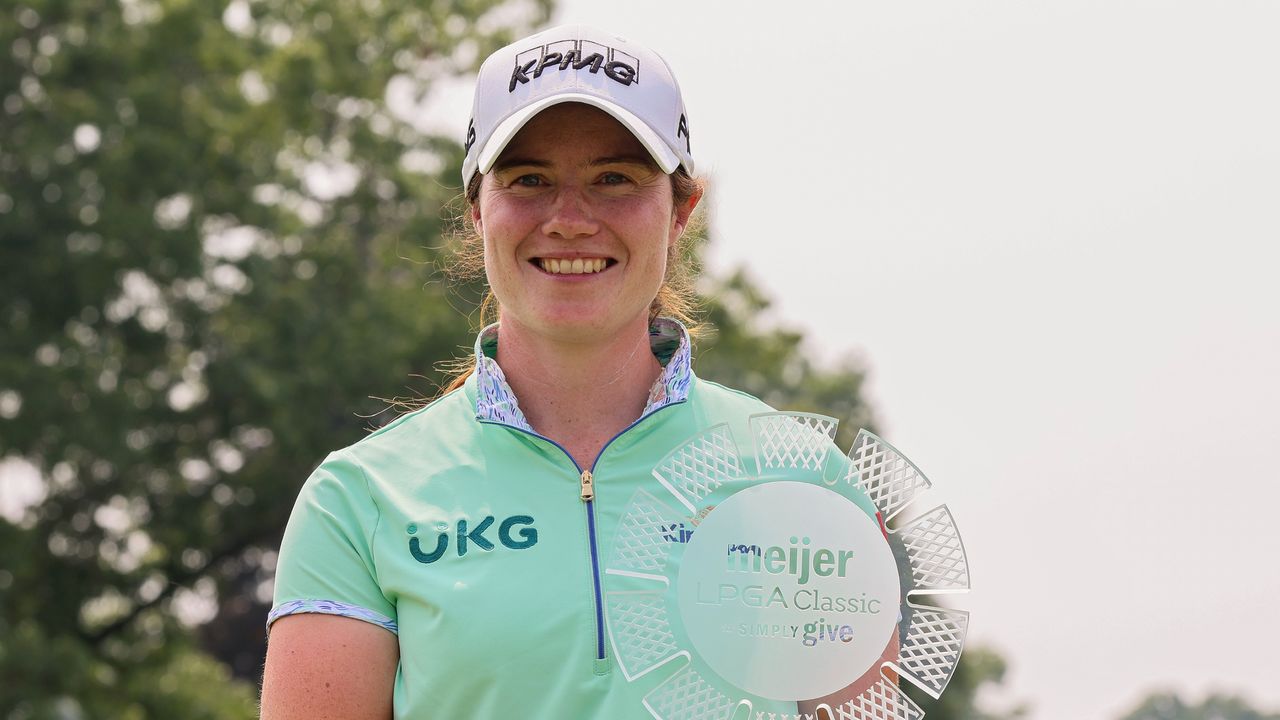 Lenoa Maguire poses for a photograph with the Meijer LPGA Classic trophy