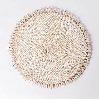 A woven Seashell Placemat from Truffle Tablescapes