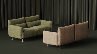 two sofas face each other in a dark green curtained room