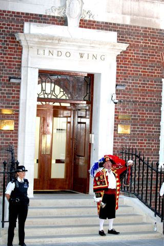 The Town Crier outside the Lindo Wing