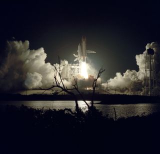 The space shuttle Discovery launches from the Kennedy Space Center in Florida to begin a classified STS-33 mission for the U.S. military on Nov. 22, 1989 