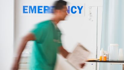 Nurse walks through emergency ward at speed