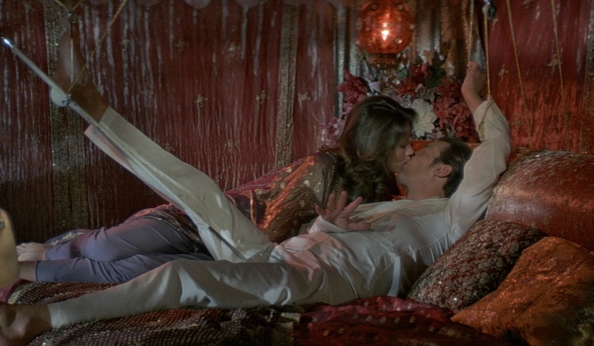 Maud Adams and an injured Roger Moore kissing in the finale of Octopussy.