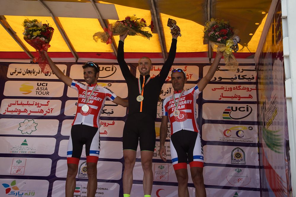 Connor McCutcheon on the podium after winning stage 1 at the Tour of Iran