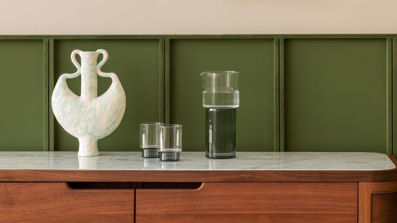 Two-toned glassware on a mid-century modern sideboard