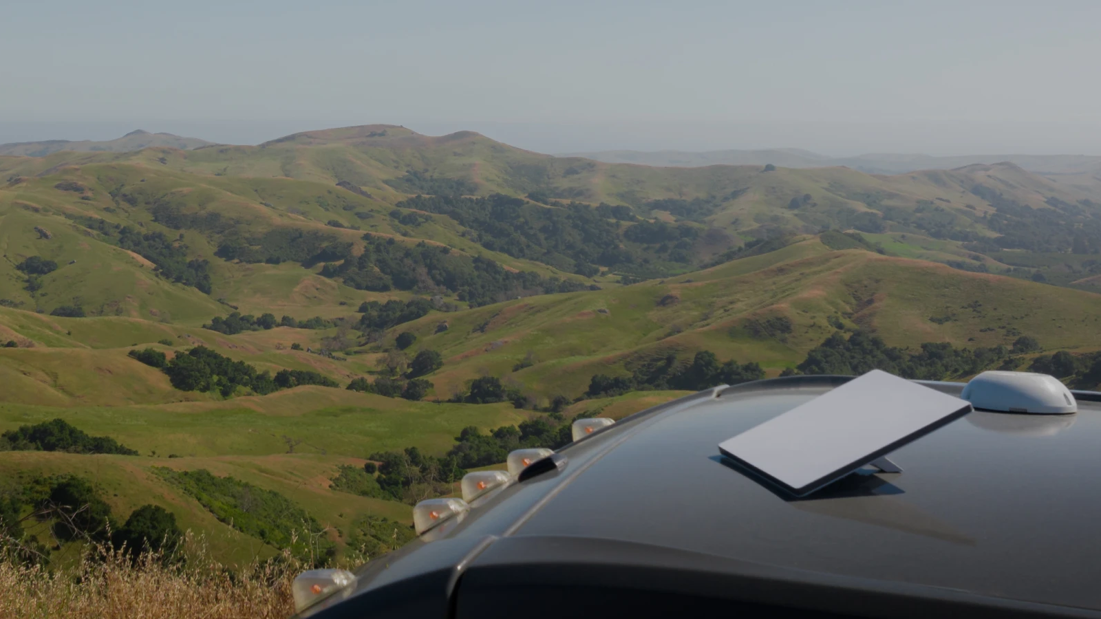 Image showing a Starlink Mini antenna on the roof of a van