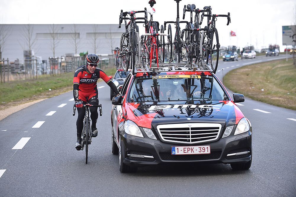 A BMC rider gets service at the team car.
