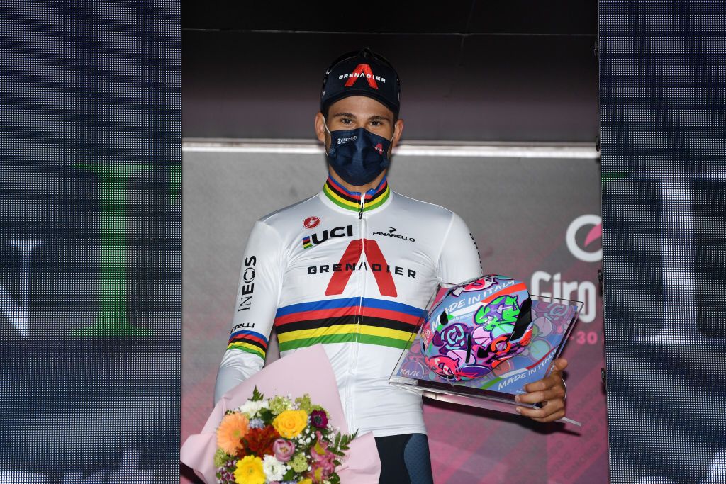 TURIN ITALY MAY 08 Filippo Ganna of Italy and Team INEOS Grenadiers stage winner celebrates at podium during the 104th Giro dItalia 2021 Stage 1 a 86km Individual Time Trial stage from Torino to Torino Mask Covid safety measures Trophy Kask Helmet special edition ITT girodiitalia Giro on May 08 2021 in Turin Italy Photo by Tim de WaeleGetty Images