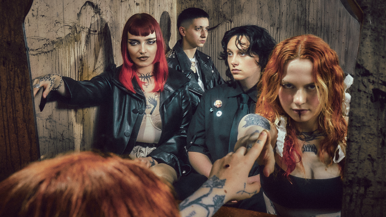 Witch Fever posing in front of a mirror