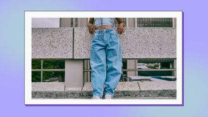 Woman dressed in baggy jeans and crop top