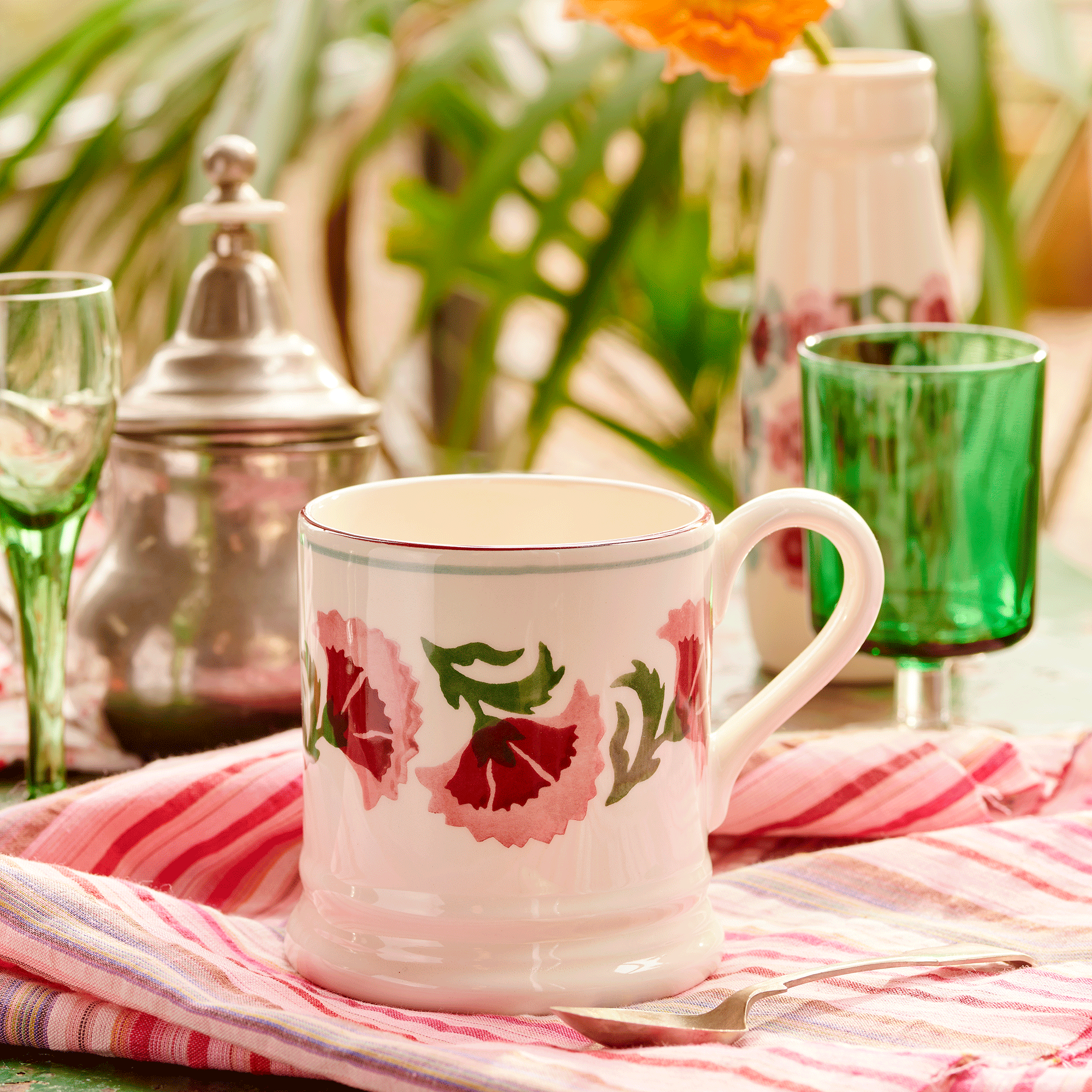Mug with pink pattern on on pink tablecloth