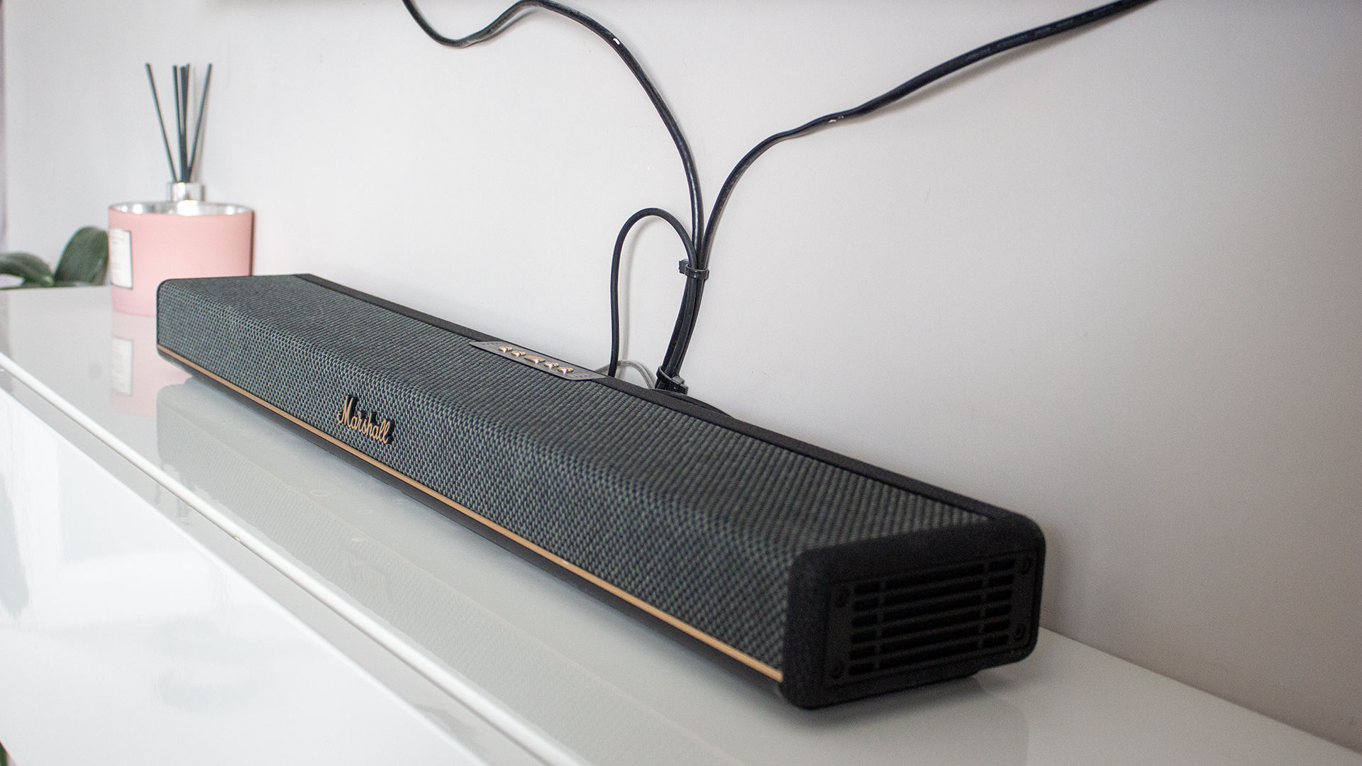 an image of marshall's heston 60 soundbar in a simple white room